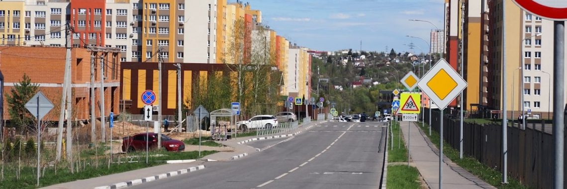 A road lined with buildings and signs